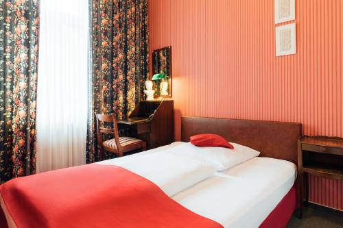 Postel nebo postele na pokoji v ubytování Das Kleine Hotel in ruhiger Stadtlage