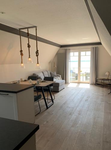 a living room with a couch and a table at Eldenholz FeWo8 in Waren