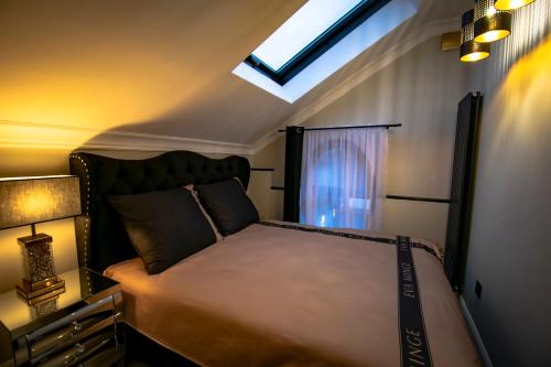 Ένα ή περισσότερα κρεβάτια σε δωμάτιο στο Willa Buk APARTAMENTY