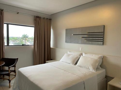 Ένα ή περισσότερα κρεβάτια σε δωμάτιο στο Hotel Relicário