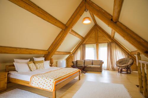 a bedroom with a bed in a attic at Chervona Ruta in Shaian