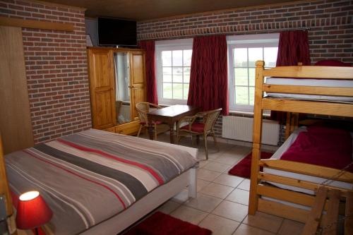 Postel nebo postele na pokoji v ubytování Breeden Steeger Hoeve