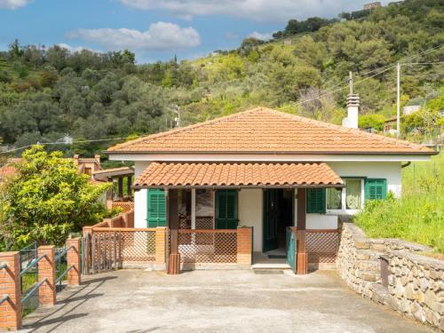 a small house with a fence in front of it at Holiday Home Ludovica by Interhome in Soldano