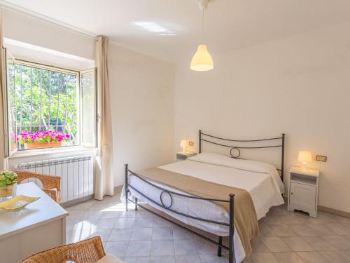 a bedroom with a bed and a window at Holiday Home Masseria Difesa Grande by Interhome in Montenero di Bisaccia