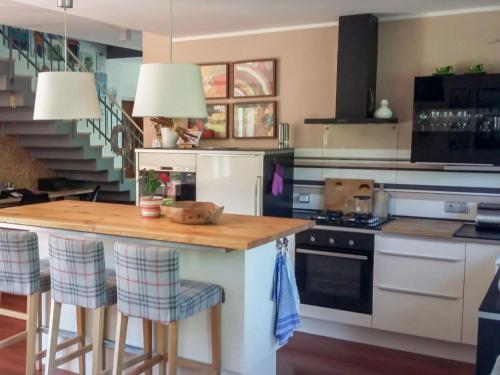 a kitchen with a island with a counter top at Holiday Home Řeporyje by Interhome in Prague