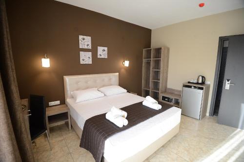Postel nebo postele na pokoji v ubytování NABRO Resort