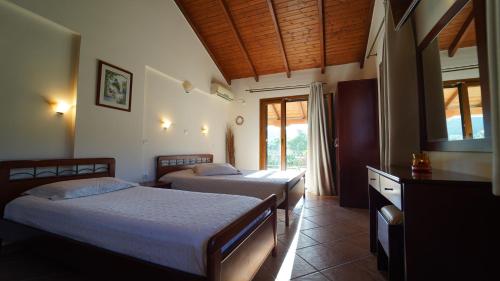 Ένα ή περισσότερα κρεβάτια σε δωμάτιο στο Villa Apollo