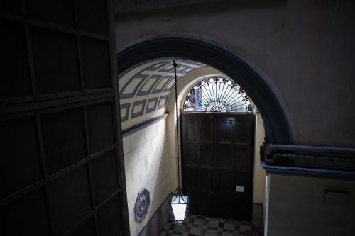 an entrance to a building with a door and a window at 4heavens_naples in Naples