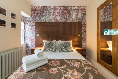 Ένα ή περισσότερα κρεβάτια σε δωμάτιο στο Johnstone Apartment by The National Trust Scotland