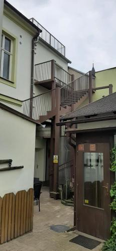 a building with balconies on the side of it at Pension Fontána Svitavy in Svitavy