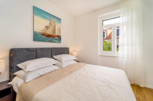Posteľ alebo postele v izbe v ubytovaní Apartman Letifico