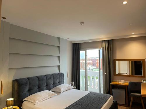 Postel nebo postele na pokoji v ubytování Light Hotel