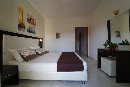 a bedroom with a large bed in a room at Villa Apollo in Parga
