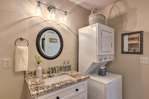 a bathroom with a sink and a mirror at Cozy Landrum Escape by Parks, Trails and Lakes! in Landrum