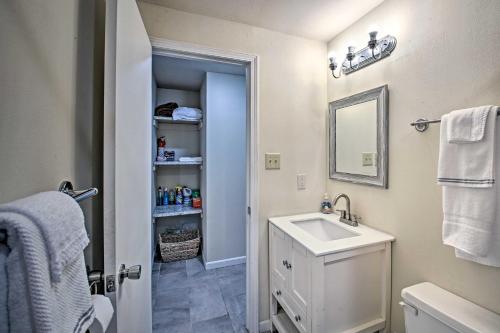 a white bathroom with a sink and a mirror at Near Natl Park Hollywood Park Hot Springs Home in Hot Springs