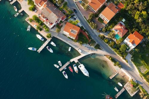 an aerial view of a marina with boats in the water at Apartment in Kampor with sea view, terrace, air conditioning, Wi-Fi (4610-1) in Kampor