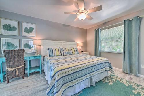 a bedroom with a bed and a ceiling fan at Canal-front Gem with Pool and Hot Tub in Anna Maria in Anna Maria
