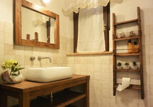 a bathroom with a sink and a mirror at Agriturismo Podere Il Sorbo in Campagnatico