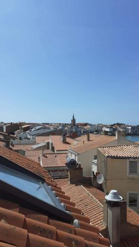 a view of the roofs of a city at Hôtel SABLES D'O et son restaurant LE 16 BIS in Les Sables-dʼOlonne