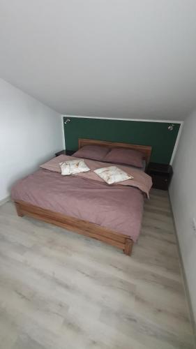 a bedroom with a bed with two pillows on it at Restauracja Domenico w Tylawie in Tylawa