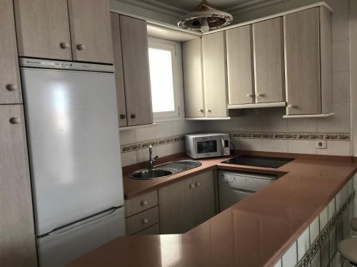 A kitchen or kitchenette at Almería Centro