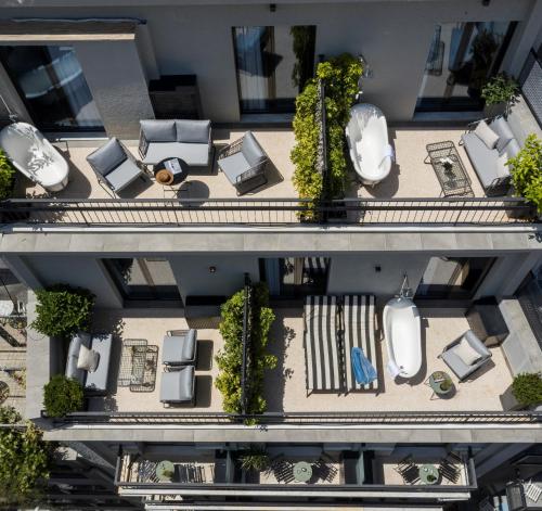 an overhead view of a building with chairs and tables at PAME House in Athens