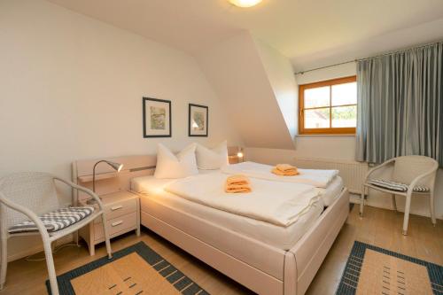 Katil atau katil-katil dalam bilik di Ferienpark Freesenbruch Wohnung 2 5 - Auszeit