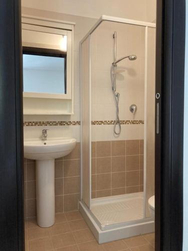 a bathroom with a shower and a sink at Casa Ulivo in Pulsano