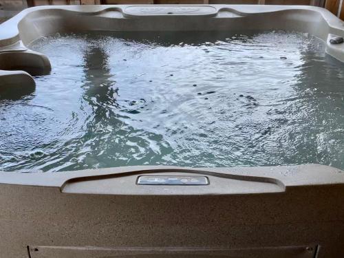 a pool of water in a bath tub at Bonne Bay Cottages in Bonne Bay Pond