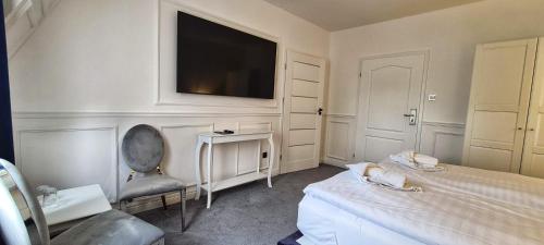 Ένα ή περισσότερα κρεβάτια σε δωμάτιο στο Monte Carlo Boutique Hotel
