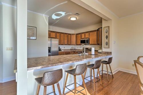 a kitchen with a large island with bar stools at New ! Slopeside Townhome : WFH, Ski, Dine & Hike in Tannersville