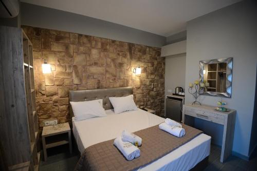 Ένα ή περισσότερα κρεβάτια σε δωμάτιο στο NABRO Resort