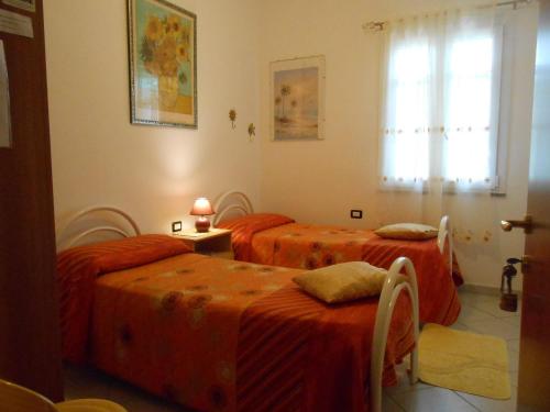 Tempat tidur dalam kamar di I Girasoli