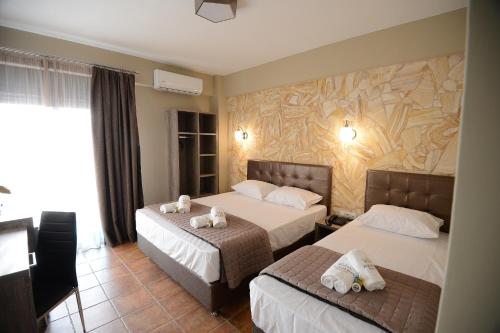 Postel nebo postele na pokoji v ubytování NABRO Resort