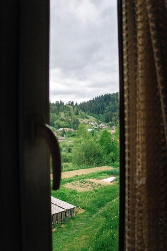 a view of a field from a window at Котедж з неймовірними краєвидами, Карпатський Чан DREAM, Чан Джакузі in Slavske