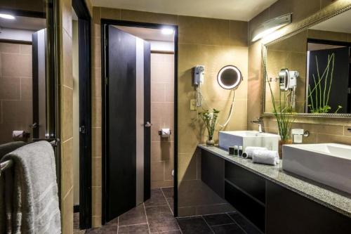 A bathroom at Urban Green Hotel & Suites