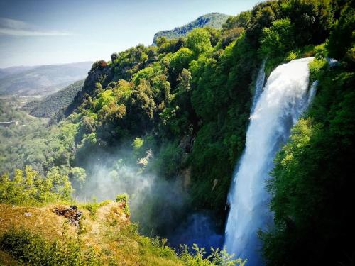 a waterfall in the middle of a mountain at Casa Vacanze Le Cascate in Le Marmore
