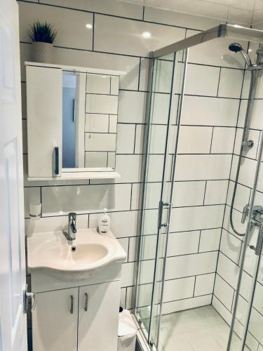 a bathroom with a sink and a shower at Chadberry House Hotel in Blackpool