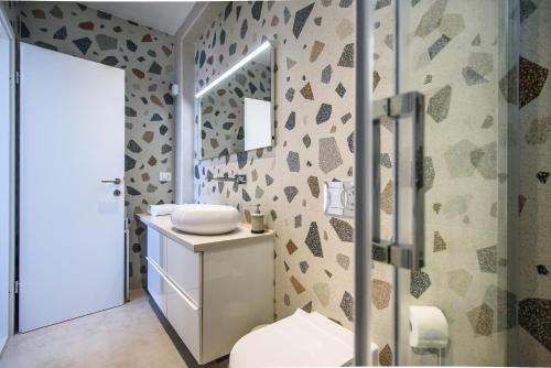 a bathroom with a sink and a mirror at Villa Leoni in Dubrovnik