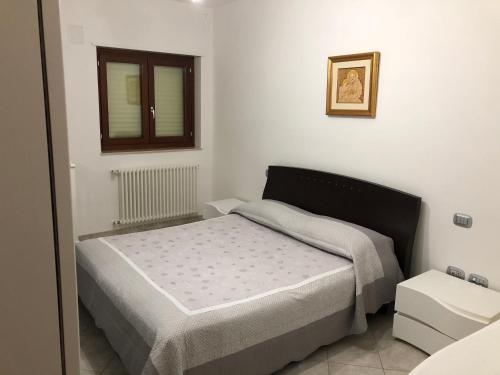 A bed or beds in a room at Casa vacanza bella Puglia