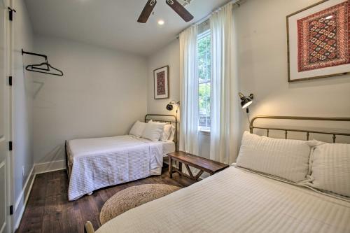 a room with two beds and a window at Chic Escape with Furnished Deck Walk to Cafes! in New Orleans