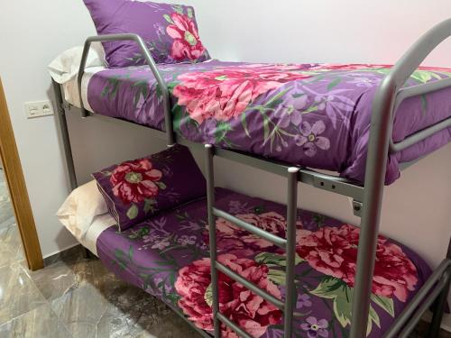a couple of bunk beds in a room at -Apartamentos Laguna- in Puerto de Mazarrón