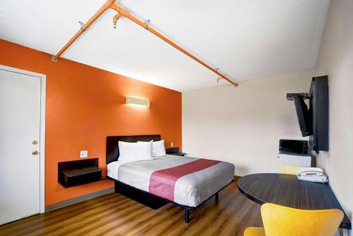 a hotel room with a bed and a table at Motel 6-Ilion, NY in Ilion
