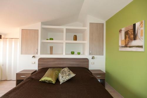 Postel nebo postele na pokoji v ubytování Apartmani Iva