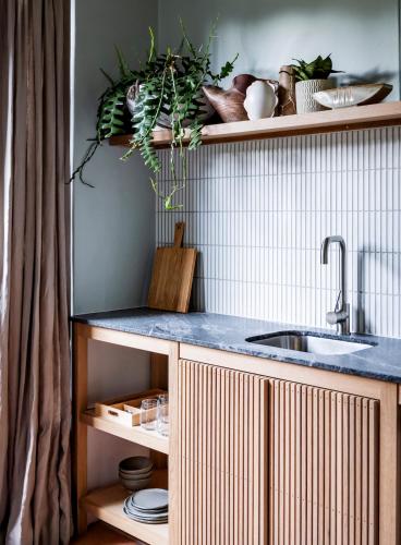a kitchen with a sink and a counter top at Bondi Beach House in Sydney