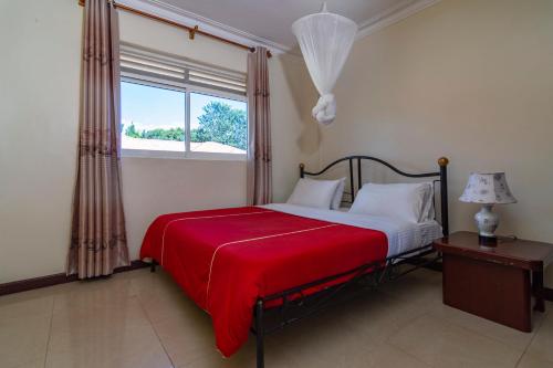 Vuode tai vuoteita majoituspaikassa Karibu BB Suites