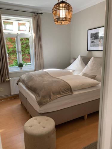 Un pat sau paturi într-o cameră la Hof Lohmann