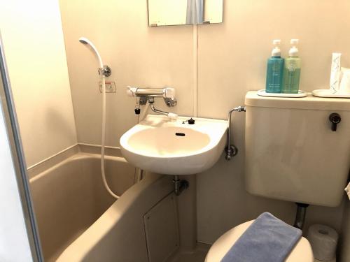 Een badkamer bij Garden Hotel Yamato