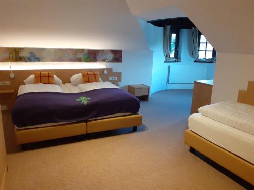 Postel nebo postele na pokoji v ubytování Family Hotel Schloss Rosenegg