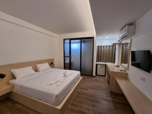 Postel nebo postele na pokoji v ubytování Pimann Place Hotel